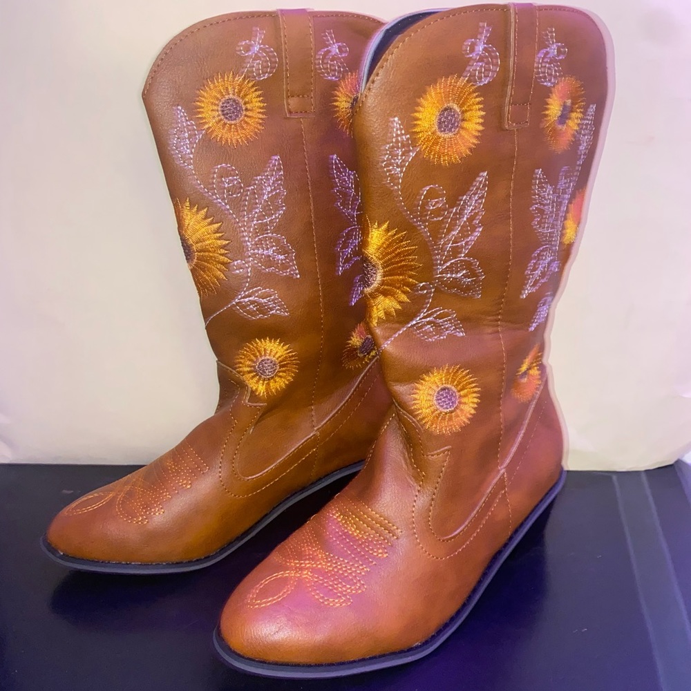 Brown size 6 calf high boots with sunflower designs.